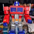 op_on_stand.jpg Robosen Optimus Prime Founders Edition Display Stand