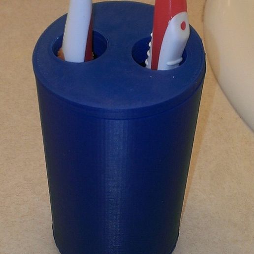 Toothbrush holder with large holes for large handled toothbrushes
