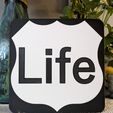 PXL_20230901_114548877.jpg Life is a Highway Sign