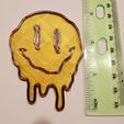 smile3.jpg Melting Smiley Face Plate and Keychain