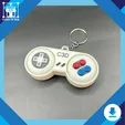 il_fullxfull.6721333088_be54.webp Retro Controller Fidget Keychain STL – 3D Printable Clicker Toy with Keyboard Buttons | STL File Pack for Gamers, Nerd Gifts, Fidget Lovers