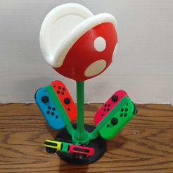 381254485_184416174684037_2245663728967156554_n.jpg STL file Nintendo Switch Joycon Carousel Holder (Piranha Edition)・Model to download and 3D print