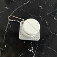 image0.jpg Porta-chaves Tablet/Pill Clicker