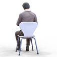 ManSitiing_1.12.66.jpg A Man sitting on a chair with smartphone