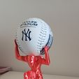 20240731_185348.jpg Atlas holding base ball