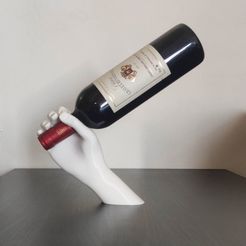 343294376_763956268617774_1665968161311337470_n.jpg Balancing Hand - Wine Bottle Stand