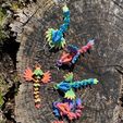 346104768_800433115131478_8108716307647495853_n.jpg Free STL file Rainbow Dragon Keychain・Design to download and 3D print
