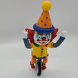 ClownFront.jpg Clown on Unicycle