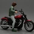 3DG-0003.jpg Young man sitting on his motorbike - Separated and non separated
