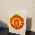 image.jpg Manchester United logo with stand