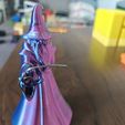 rv0ny1.jpg Wizard Figurine — robed mage with a magnet hand