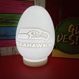 IMG_20231228_174309660.jpg Seattle Seahawks FOOTBALL EASTER EGG FILLABLE AND OR TEALIGHT