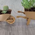 wheelbarrow-3.jpg wheelbarrow shaped planter for succulents