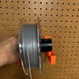 IMG_0366.jpg Filament spool holder bracket for pegboard mounting