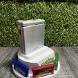 441426839_25513731964908662_3621620539134365080_n.jpg CIRCULAR GAMEBOY ADVANCE SP HOLDER / STAND WITH 6 GAME CARTRIDGES CASES