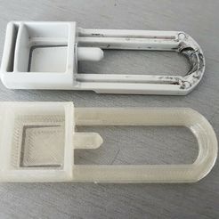 photo1.jpg The latch for the wheel of a baby stroller STOKKE
