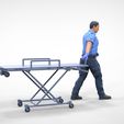AW1-1.1.33.jpg N1 Ambulance worker pulling wheeled stretcher or trolley