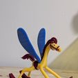 PXL_20260216_203645114.jpg Alice in Wonderland rocking horse figurine