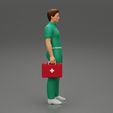3DG-0002.jpg paramedic Standing And Holding first Aid box
