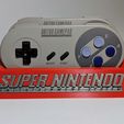 bc302475b03b875df41e75524215bada_display_large.jpg Archivo STL gratis 8Bitdo SNES30/SFC30 Soporte de controlador・Modelo de impresión 3D para descargar