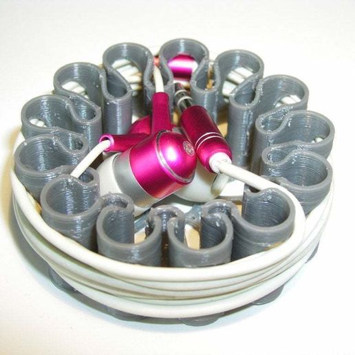 P1010008.JPG Earbud spool with cable fixing feature