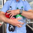 IMG_1235.jpg Bottle Buddy: Universal Soda Bottle Carrier with Ergonomic Handle & Magnetic Storage – Fits Most 1L to 2L Bottles Worldwide