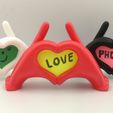IMG_20230119_200457_edit_180828323759386.jpg Archivo STL Manos de corazón Soporte para teléfono y marco de fotos・Objeto de impresión 3D para descargar