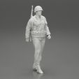 Girl-0007.jpg Soldier walking carrying a rifle