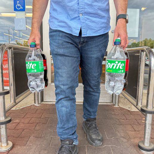 IMG_1240.jpg Bottle Buddy: Universal Soda Bottle Carrier with Ergonomic Handle & Magnetic Storage – Fits Most 1L to 2L Bottles Worldwide