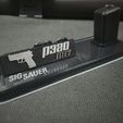 351001934_6152349291548222_702071478415399811_n.jpg Sig Sauer P320 Stand With Logo