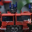 FACEMASK.jpg Transformers Rise of the Beasts Unmasked and Masked Optimus Prime Head for SS38