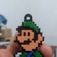WhatsApp-Image-2023-06-25-at-6.58.16-PM.jpeg Luigi pixel art style keychain