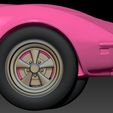 69.jpg Gizmo in a pink Corvette