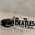 photo_2023-04-23_22-00-31.jpg Beatles keychain