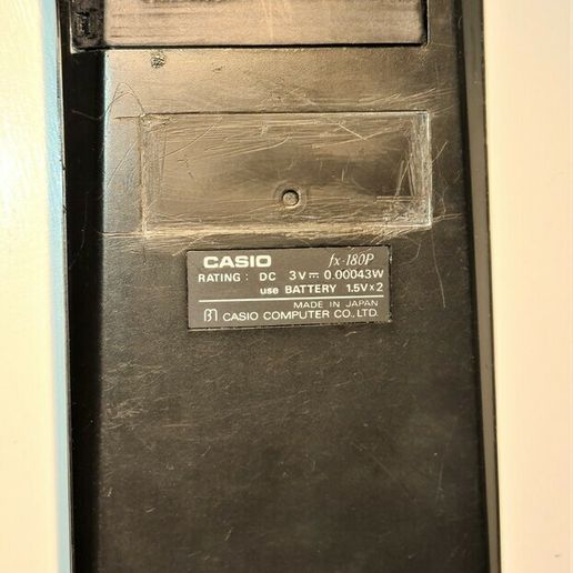 0b97b54b-4e0e-402d-9949-32b68be21fc8.jpg Casio FX 180P battery cover