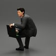 3DG-0005.jpg businessman sitting and holding briefcase of money