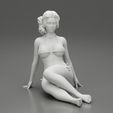 3DG-0007.jpg Femme sexy assise en bikini sur la plage
