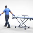 AW1-1.1.21.jpg N1 Ambulance worker pulling wheeled stretcher or trolley