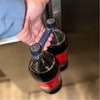 IMG_3953-2.jpg Bottle Buddy: Universal Soda Bottle Carrier with Ergonomic Handle & Magnetic Storage – Fits Most 1L to 2L Bottles Worldwide