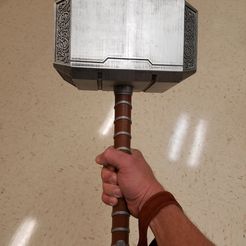 Mjolnir_Holding.jpg Mjolnir (Thor's Hammer)