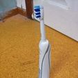 tbs02.jpg Oral-b Toothbrush & Clock Stand
