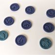 PXL_20220505_105439350.jpg Command tokens for futuristic wargame of the 40th millennium