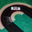 Marvin_rounds_the_bend.JPG R1.5 cambered curve - slot car track and borders - Scalextric