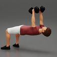 Girl-0003.jpg Muscular man working out in gym doing exercises with dumbbell chest