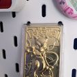 a0b4f274-f196-4bf9-8fed-18b9b9928a6b.jpg Gold Plated Pokemon Trading Card Skadis Mount