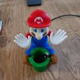 1000014625.jpg Mario Phone Holder