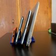 bfdebe66-3671-4343-81aa-2468be8d1b93.jpg Quadruple Device Stand