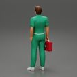 3DG-0004.jpg paramedic Standing And Holding first Aid box