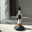 1f6d7604-9d7c-49af-8618-c03764a5666f.jpg Motorized Lighthouse Display Model on a Rock