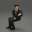 3DG1-0006.jpg businessman sitting and holding briefcase of money